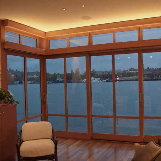 recessed lighting above floor to ceiling windows